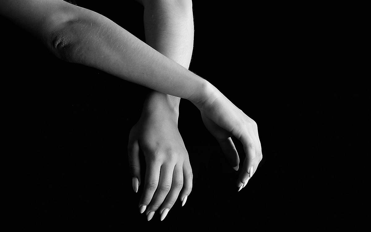 hand close-up photo of two human hands black-and-white